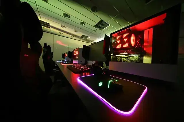 gaming setup with multiple monitors and RGB lighting